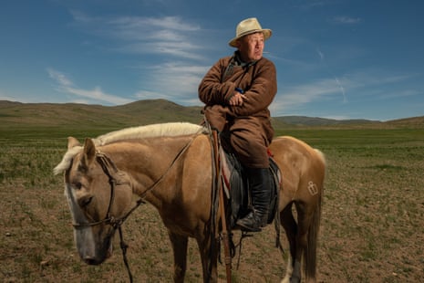 Ranger Choinzon Gan-Erdene sits on his horse after a day of riding.