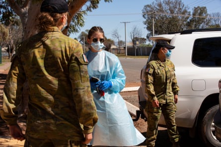 Sarah Donnelly, the local deputy principal of the Wilcannia school, directs police and the defence force as they help with food deliveries