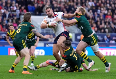 Mike McMeeken runs into a wall of Australia players.