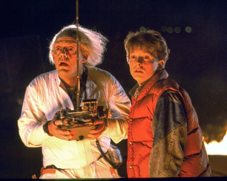 Michael J Fox, right, with Christopher Lloyd in 1985’s Back to the Future.