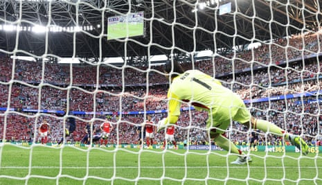 Paris St Germain’s Ousmane Dembele scores their equaliser from the penalty spot past Arsenal’s David Raya.