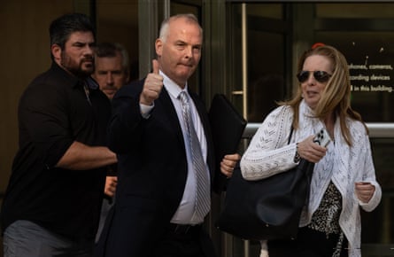 Retired NYPD sergeant Michael McMahon (C) leaves Brooklyn federal court on 31 May. He has been charged with being part of a conspiracy to hound former Chinese city official Xu Jin and his family to get him to go back to his homeland.