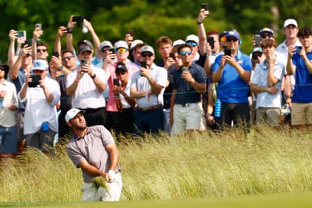 Scottie Scheffler hits from the rough on the 9th hole during the first round of the 2025 US Open.