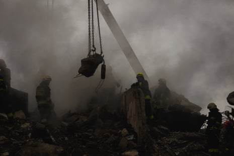 Rescuers use special equipment while searching for people trapped under the rubble of a high-rise residential building hit by a missile in Dnipro.