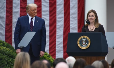 Donald Trump listens as Amy Coney Barrett speaks at the White House in Washington DC, on 26 September. 