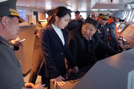 Kim Jon-un and his daughter observing the trials of a destroyer in early June.