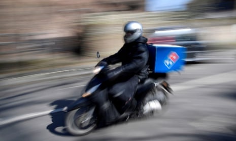 domino's pizza delivery rider on a motorbike