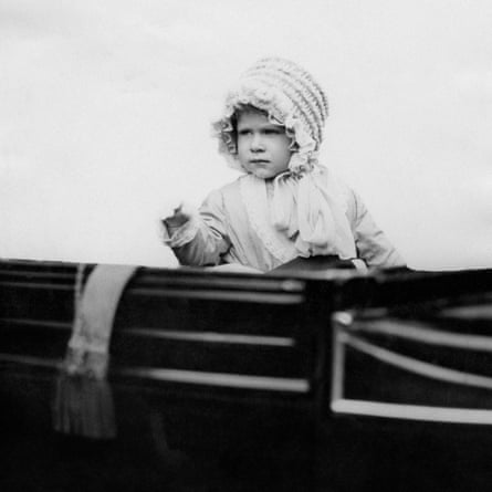 The then Princess Elizabeth waves from a carriage in London in 1928