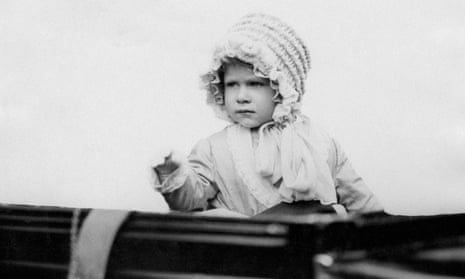 the queen as a toddler waves from a car