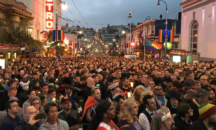 People gather in the Castro District for a vigil for the victims of the Orlando shooting.