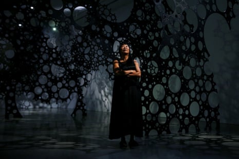 Lindy Lee poses from inside her sculptural work Moonlight Deities at Museum of Contemporary Art on October 01, 2020 in Sydney, Australia.