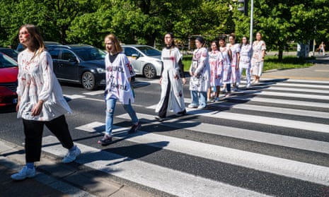 Women in Warsaw, Poland, dressed in white clothing bearing the names of Ukrainian cities and daubed in fake blood, protested against the Russian invasion of Ukraine. The protest took place on 9 May as Russian diplomats including the Russian ambassador to Poland visited the Russian Military Cemetery in Warsa to lay flowers.