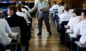 Children sit a GCSE exam