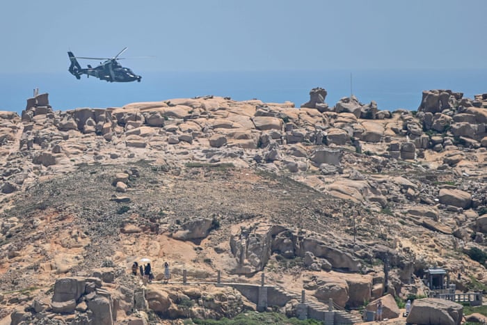 A Chinese military helicopter flies past Pingtan island, one of mainland China’s closest points from Taiwan ahead of massive military drills off the island.