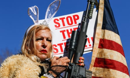 A demonstrator by the name of Cowboy Barbie, with an AR-15 rifle, protests against Biden’s inauguration, in Carson City, Nevada, on 20 January 2021.