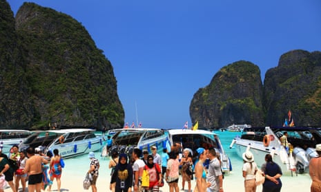 Tour boats block the view of Thailand’s Maya Bay.