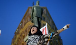 A female protester in Talaat Harb Square in Cairo, Egypt