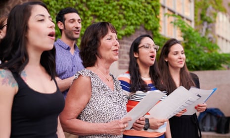Adult choir singers perform outside