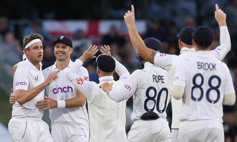 Stuart Broad celebrates with Jimmy Anderson and England teammates after bowling Devon Conway