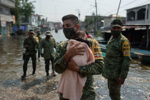 Villahermosa, MexicoA soldier carries a baby on a flooded street after heavy rains