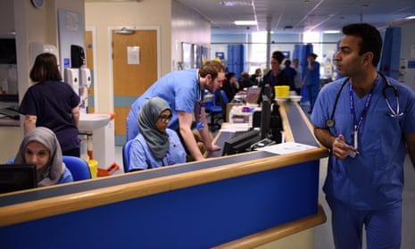 Members of clinical staff work at computers in the A&E department of the Royal Albert Edward Infirmary in Wigan.