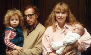As an infant with, from left, sister Dylan, father Woody Allen and mother Mia Farrow.