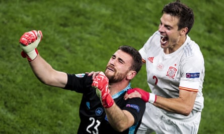 Unai Simón celebrates with César Azpilicueta after his saves in the penalty shootout helped secure victory over Switzerland in the quarter-final of Euro 2020.