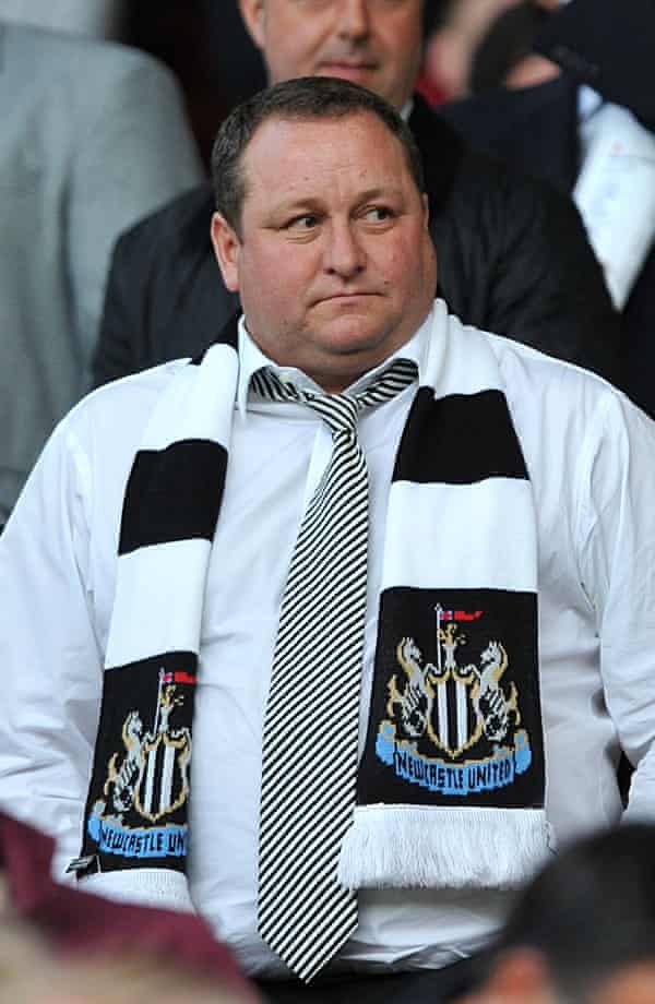 Mike Ashley wearing a Newcastle scarf