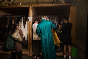 Shoppers browse racks of costumes at the Opera Australia sale.