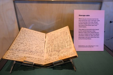 A diary displayed in a glass case.