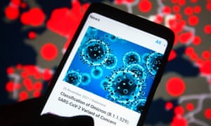 a statement from WHO (World Health Organization) about the new SARS-CoV-2 variant, Omicron, is seen on the news shown on a smartphone screen. (Photo Illustration by Pavlo Gonchar/SOPA Images/LightRocket via Getty Images)