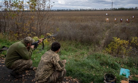 Ukrainian soldiers train marksmanship on the side of the road in Kharkiv Oblast, Ukraine on October 14, 2022,