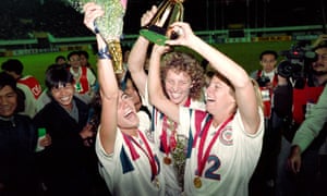Michelle Akers-Stahl (C) who scored two goals for the US to win the first FIFA World Championship for Women's Football on November 30, 1991, holds the trophy together with teammates Julie Foudy (L) and Carin Jennings (R). The US won the championship by beating Norway 2-1. The FIFA Women's World Cup is recognized as the most important International competition in women's football and is played amongst women's national football teams of the member states of FIFA. Contested every four years, the first Women's World Cup tournament, named the Women's World Championship, was held in 1991, sixty-one years after the men's first FIFA World Cup tournament in 1930AFP PHOTO TOMMY CHENG (Photo credit should read TOMMY CHENG/AFP/Getty Images)
