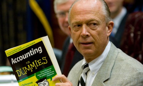 The South Carolina comptroller general, Richard Eckstrom, holds up a book he wanted to present to his new chief of staff in August 2009 in Columbia.