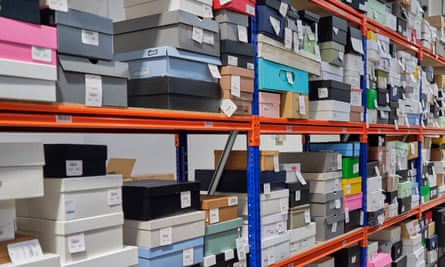 Boxes of fashion items waiting to be checked for authenticity at the Vestiaire Collective warehouse in Crawley, UK
