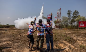 Participants launch homemade rockets during the Bun Bang Fai festival in Yasothon, Thailand