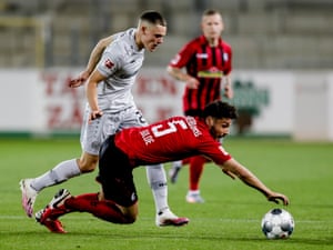 Freiburg’s Manuel Gulde (right) tussles with Bayer Leverkusen’s Florian Wirtz.