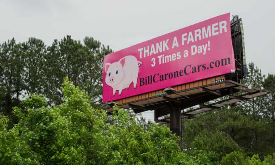 A billboard supporting pig farmers