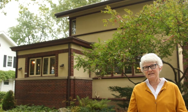 Retired teacher Linda McQuillen stands in front of her home designed by the famous architect Frank Lloyd Wright in Madison, Wisconsin.