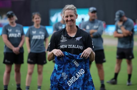 New Zealand’s Sophie Devine holds an England jersey given as a gift after playing her last ODI.