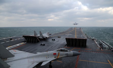 Chinese J-15 fighter jets being launched from the deck of the Liaoning aircraft carrier during military drills in the Yellow Sea
