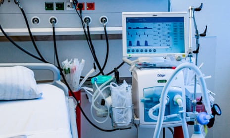 A ventilator beside a hospital bed