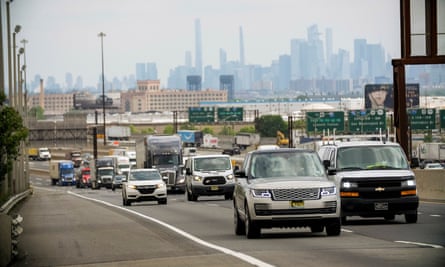 The near-impassable New Jersey Turnpike, in Elizabeth, New Jersey with the towers of New York City behind.