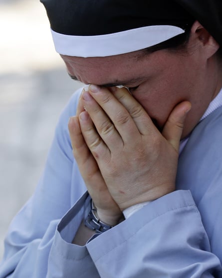 Sister Marjana Lleshi cries during an interview in Ascoli Piceno.