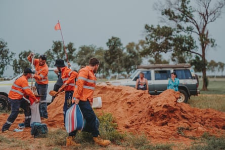 Goodline workers help fill sandbags in Port Hedland