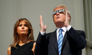 Donald Trump and Melania watch the solar eclipse from the White House in August 2017.