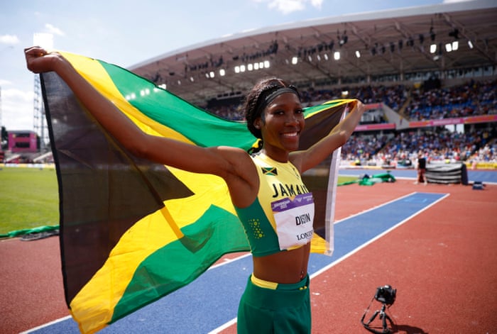 Jamaica’s Lamara Distin celebrates after winning gold in the final.
