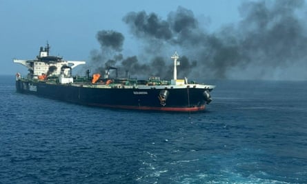 A tanker with flames and thick black smoke