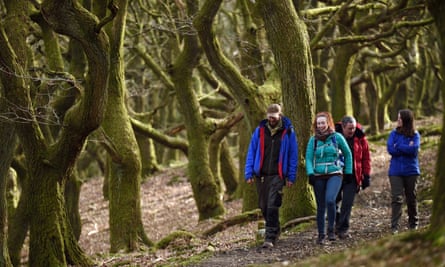 Walkers exploring St Mary’s Vale, Brecon Beacons, Powys.