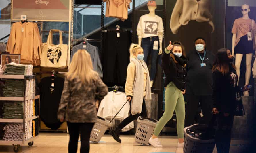 People do some early morning shopping in Oxford street, London.